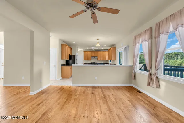 a kitchen with a refrigerator and a sink