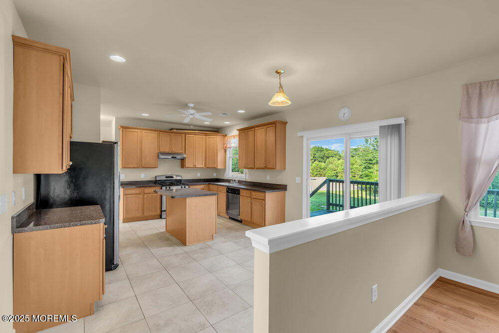 6 Eagle Ridge Lane West Creek, NJ 08092 - Photo 18 of 61 a kitchen with stainless steel appliances a stove top oven a sink and a refrigerator