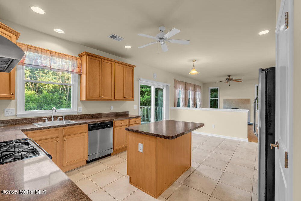 6 Eagle Ridge Lane West Creek, NJ 08092 - Photo 23 of 61 a kitchen with stainless steel appliances granite countertop a sink counter space cabinets and a large window