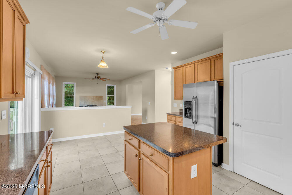 6 Eagle Ridge Lane West Creek, NJ 08092 - Photo 25 of 61 a kitchen with kitchen island a counter top space appliances a sink and a refrigerator