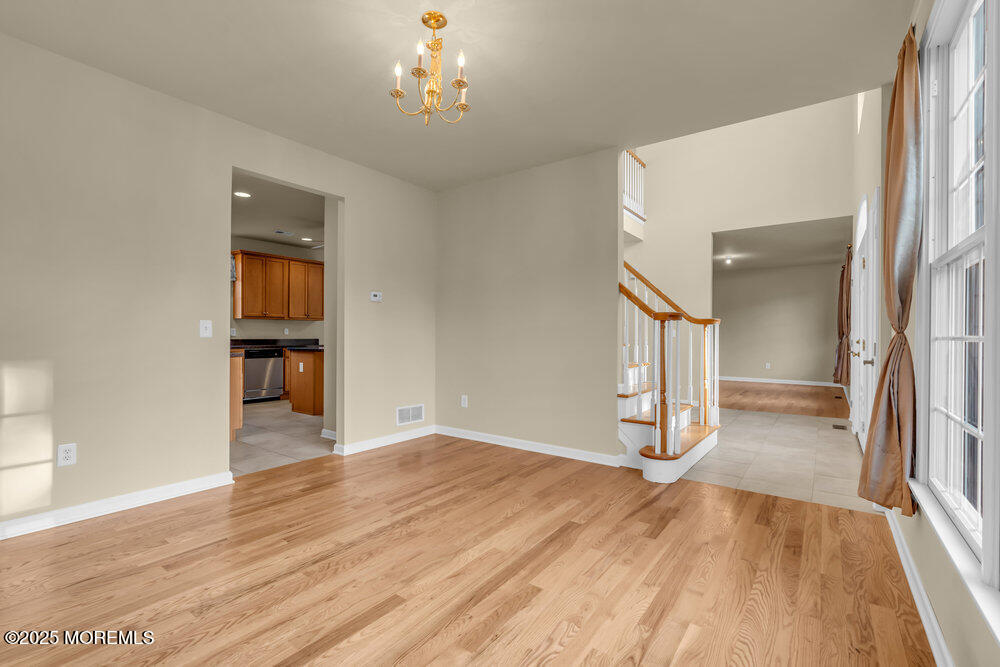 6 Eagle Ridge Lane West Creek, NJ 08092 - Photo 26 of 61 wooden floor in an empty room with a window
