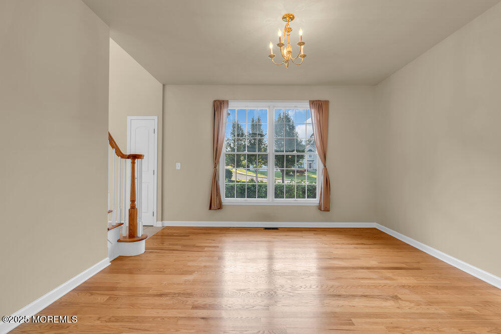 6 Eagle Ridge Lane West Creek, NJ 08092 - Photo 28 of 61 wooden floor in an empty room with a window