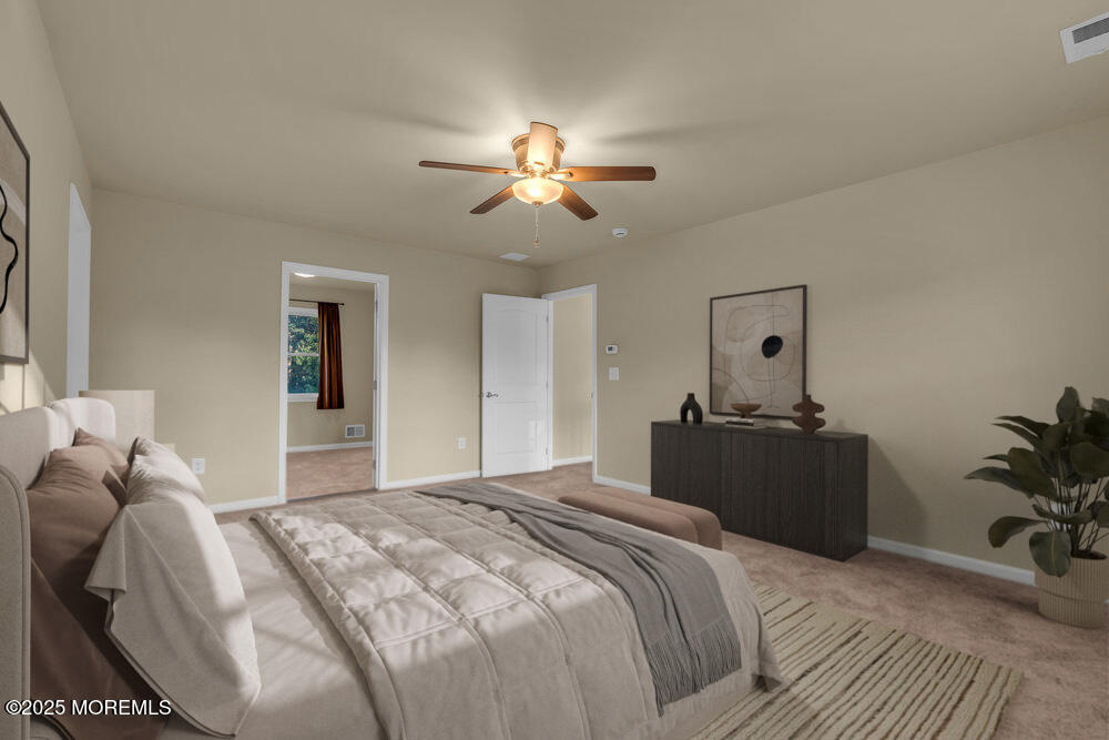 6 Eagle Ridge Lane West Creek, NJ 08092 - Photo 36 of 61 a bedroom with a bed and a chandelier