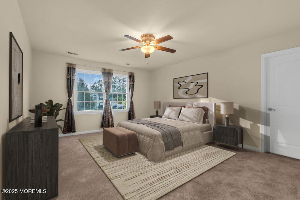 6 Eagle Ridge Lane West Creek, NJ 08092 - Photo 37 of 61 a bedroom with a large bed and a chandelier