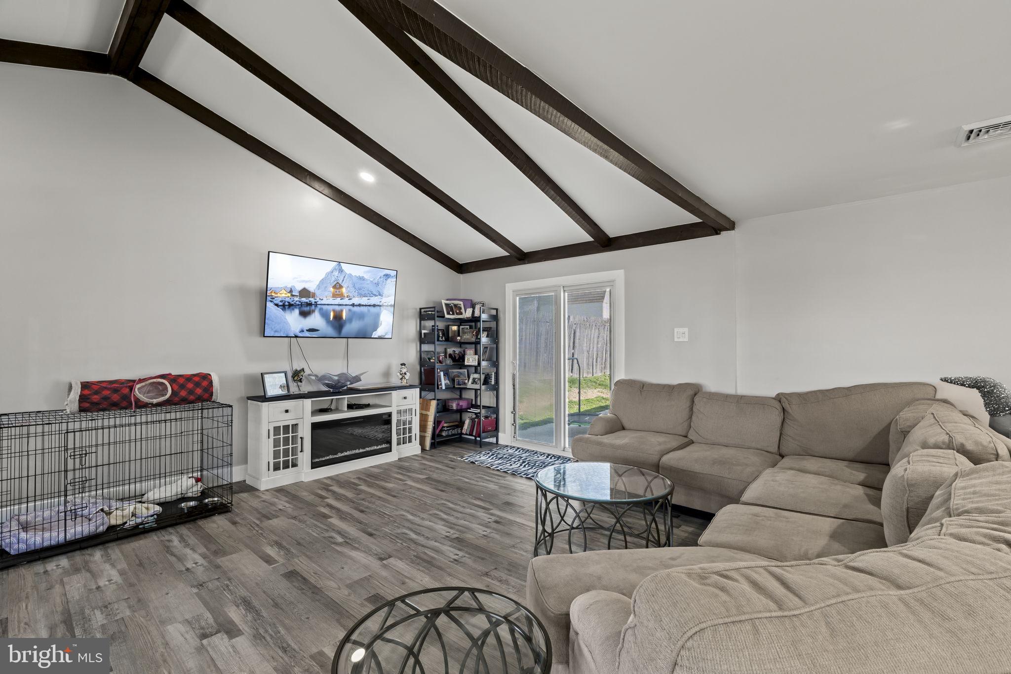 6 Black Walnut Road Levittown, PA 19057 - Photo 12 of 31 Spacious living area with vaulted beams.