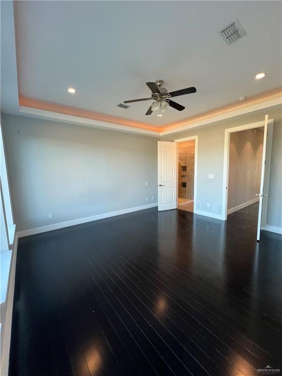 4208 Wichita Avenue McAllen, TX 78503 - Photo 15 of 24 an empty room with wooden floor and windows
