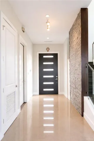 a view of a hallway view with staircase