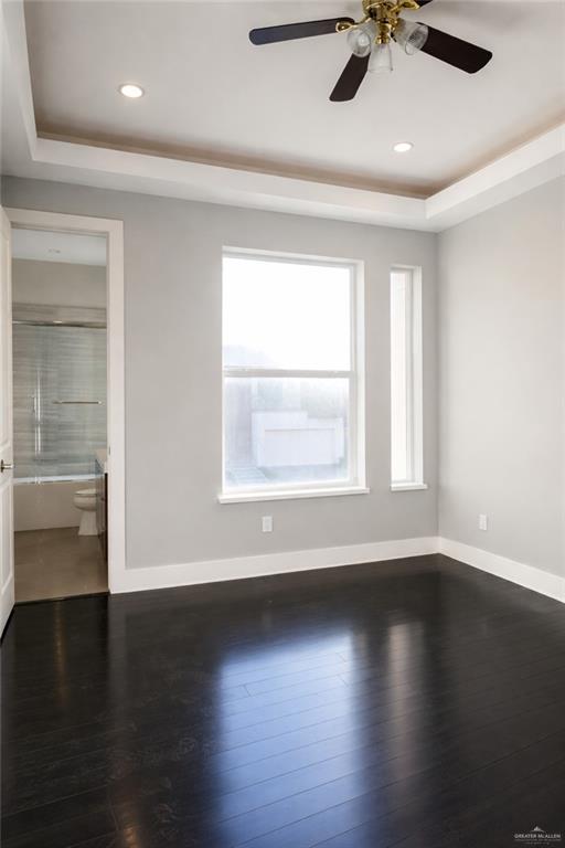 4208 Wichita Avenue McAllen, TX 78503 - Photo 22 of 24 an empty room with wooden floor fan and windows
