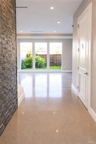 a view of empty room with floor to ceiling window