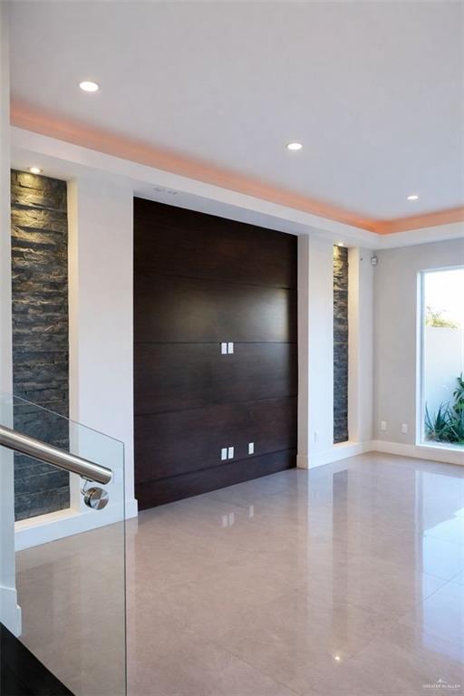 4208 Wichita Avenue McAllen, TX 78503 - Photo 5 of 24 a view of an empty room with glass door and windows