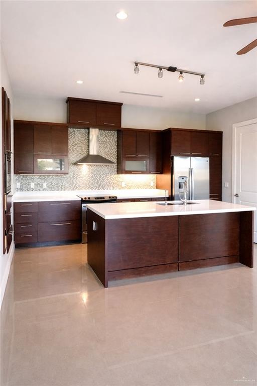 4208 Wichita Avenue McAllen, TX 78503 - Photo 9 of 24 a large kitchen with a large counter top a sink and cabinets