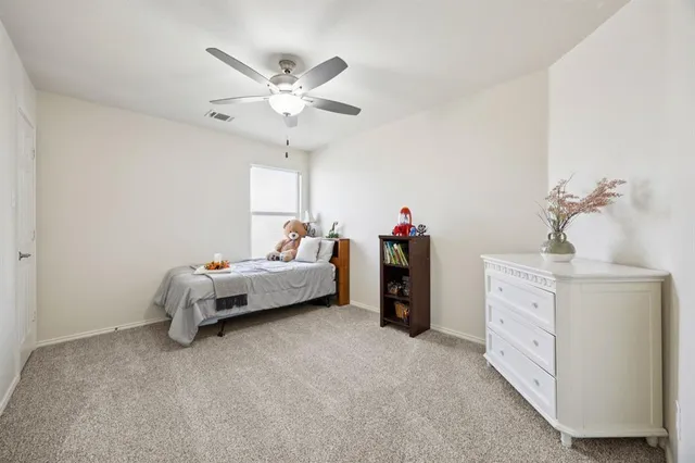a bed room with a bed and a chandelier