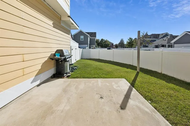 a view of a backyard with sitting area