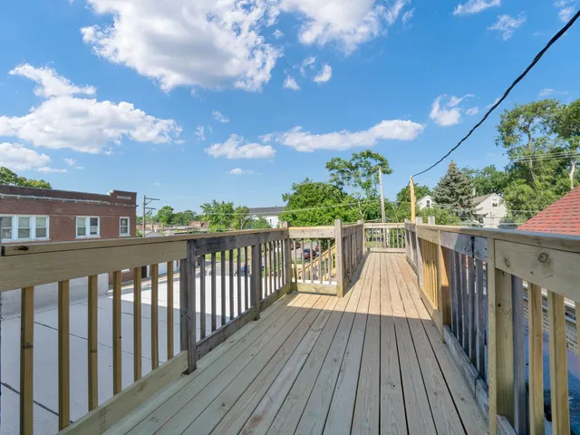 a view of deck with wooden floor and fence
