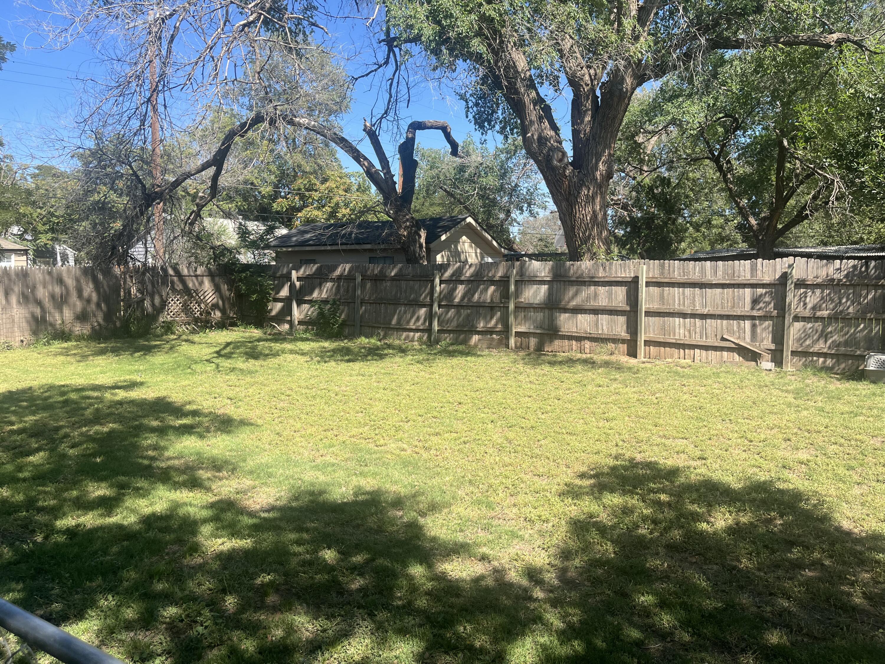2206 26th Street Lubbock, TX 79411 - Photo 11 of 15 a view of a swimming pool with an outdoor space and seating area