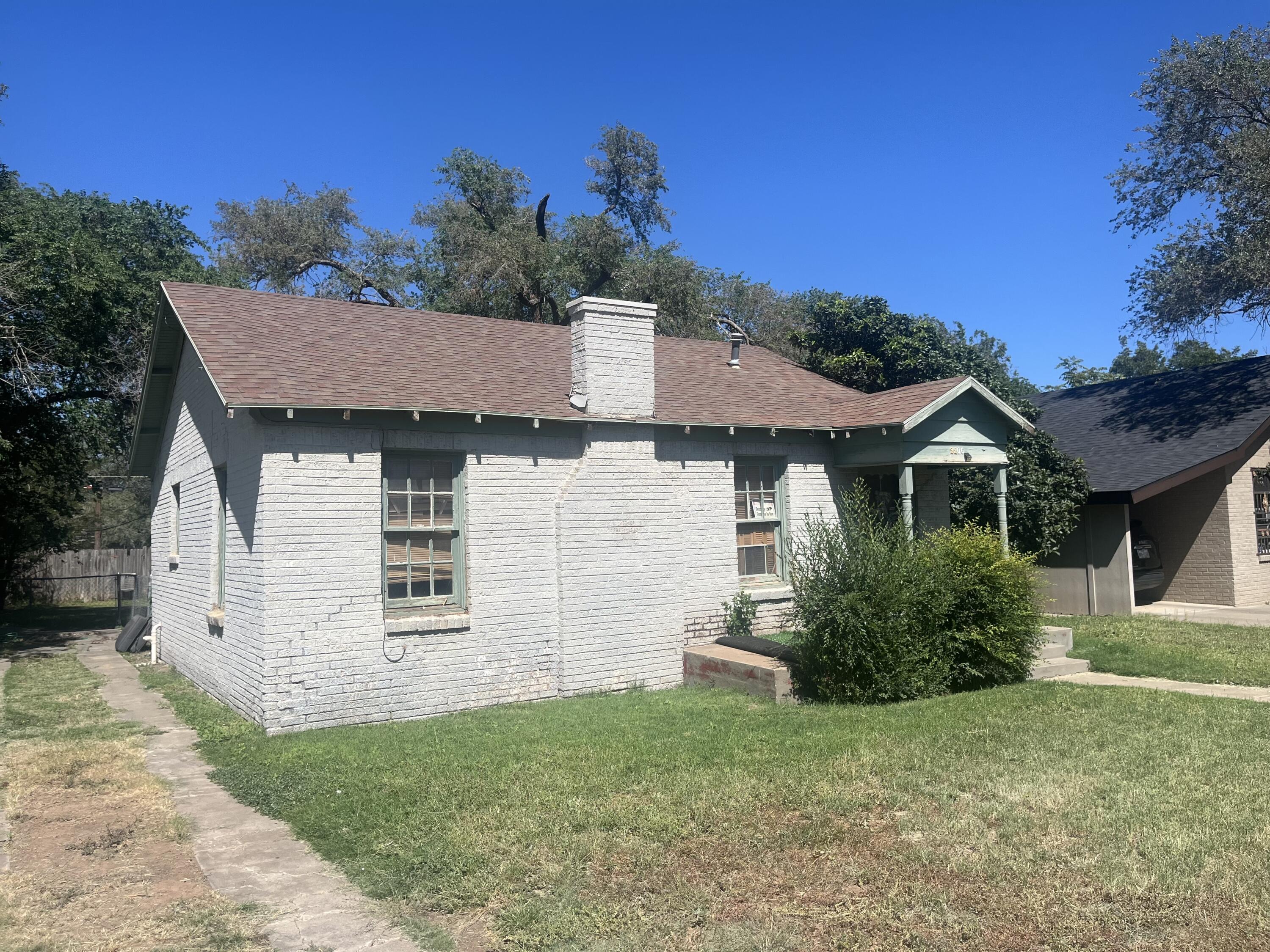 2206 26th Street Lubbock, TX 79411 - Photo 15 of 15 a front view of a house with a garden
