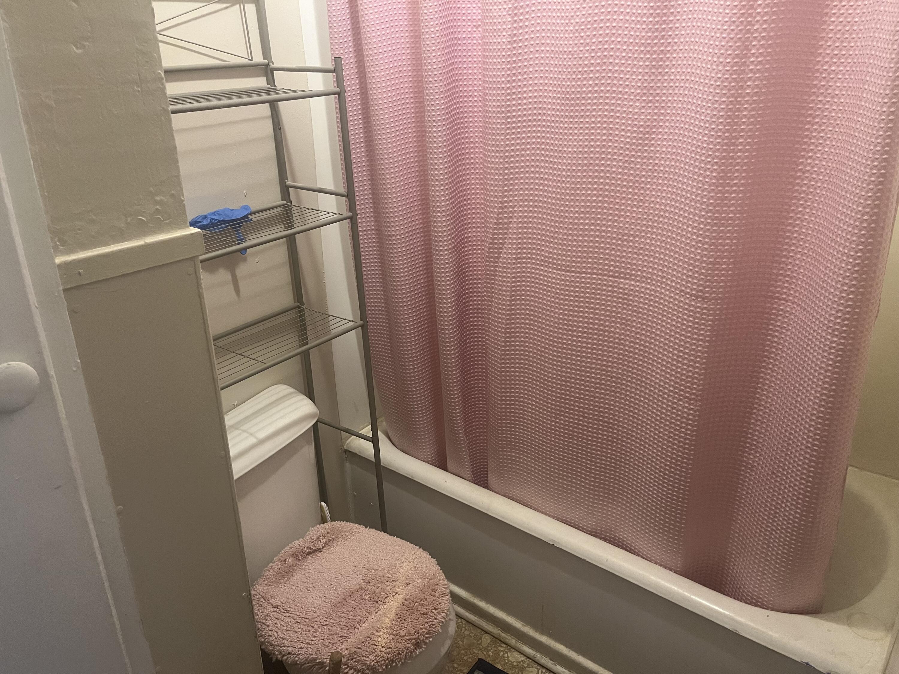 2206 26th Street Lubbock, TX 79411 - Photo 10 of 15 a bathroom with a sink and a mirror