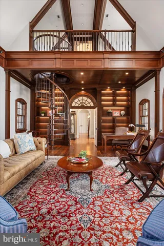 a spacious bedroom with a bed couch and a window