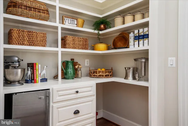 an aerial view of a house with swimming pool and outdoor space
