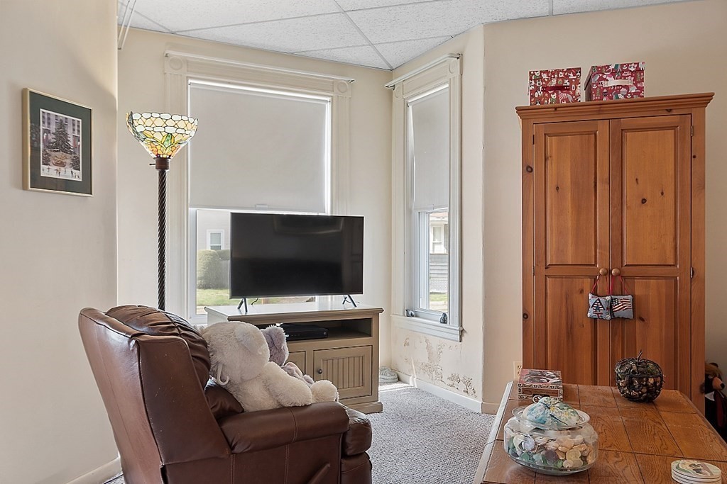 2 Bond Place Saugus, MA 01906 - Photo 11 of 42 a living room with furniture and a flat screen tv