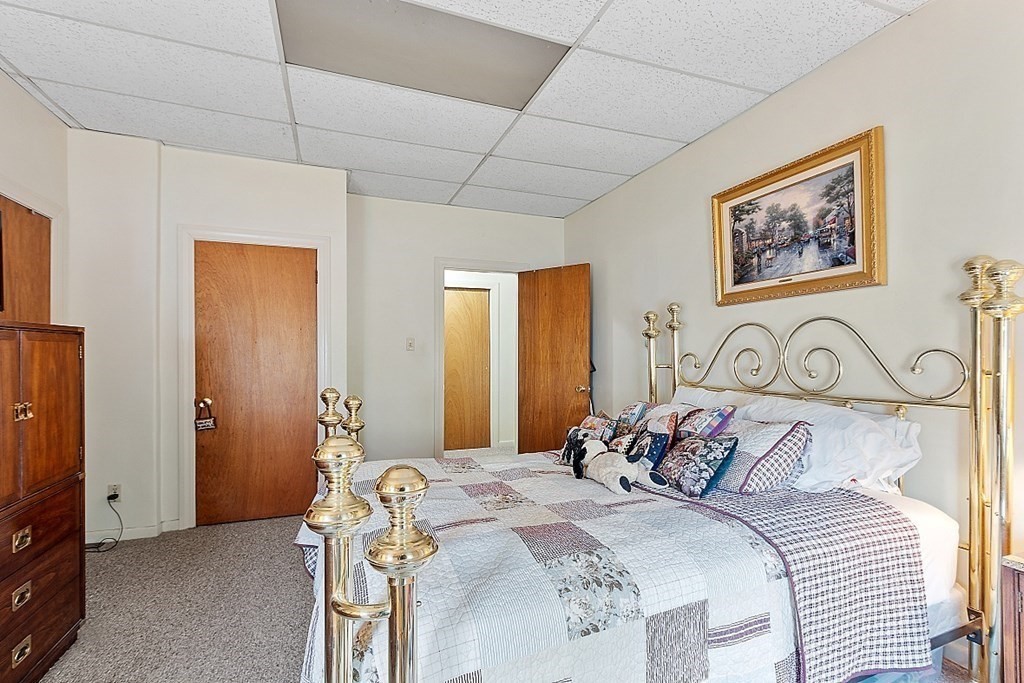 2 Bond Place Saugus, MA 01906 - Photo 15 of 42 a bedroom with a bed and a flat screen tv