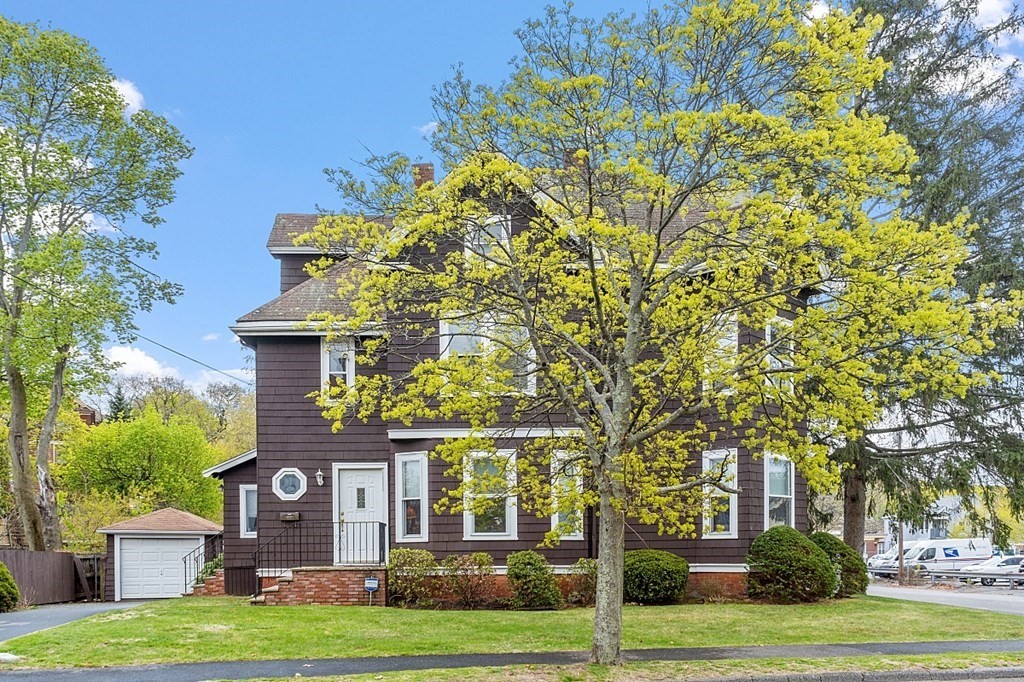 2 Bond Place Saugus, MA 01906 - Photo 2 of 42 a front view of a house with a garden