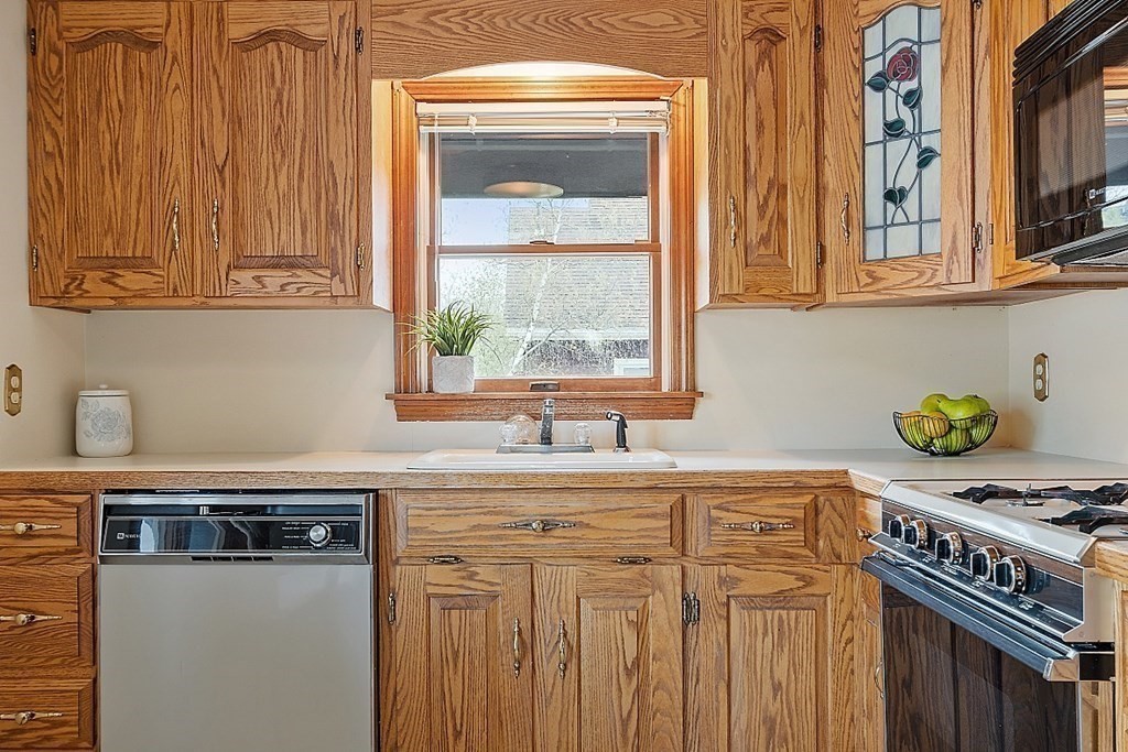 2 Bond Place Saugus, MA 01906 - Photo 21 of 42 a kitchen with stainless steel appliances a sink and a cabinets