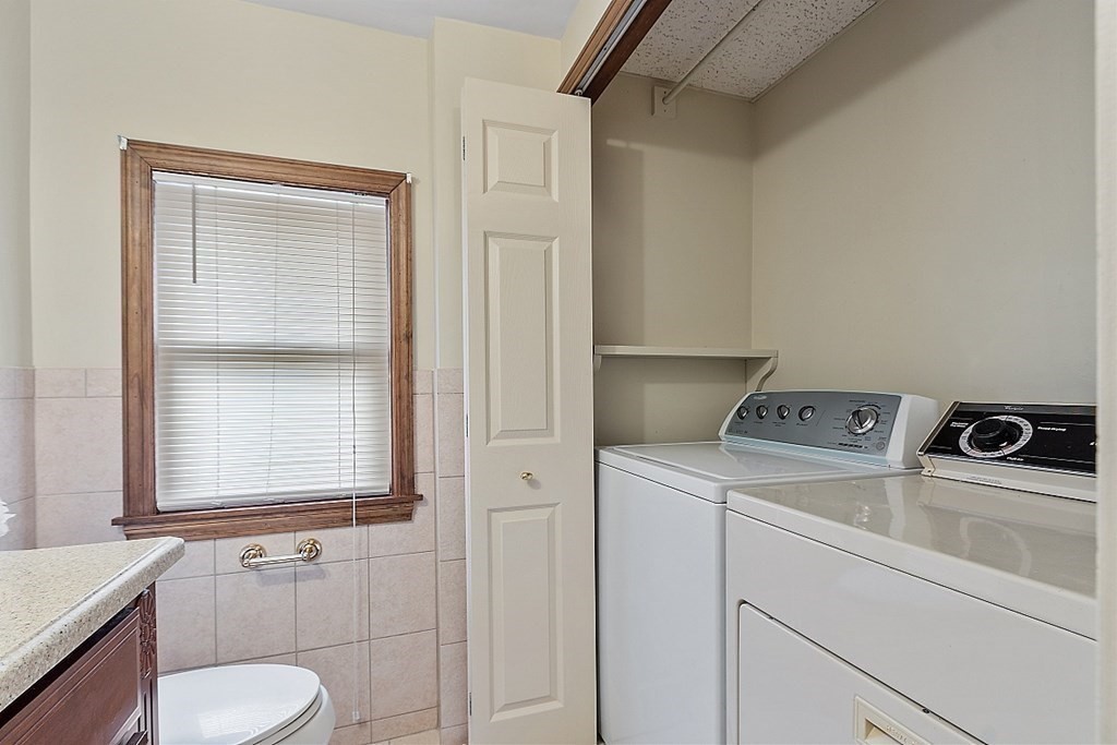2 Bond Place Saugus, MA 01906 - Photo 25 of 42 a bathroom with a sink and a washer dryer