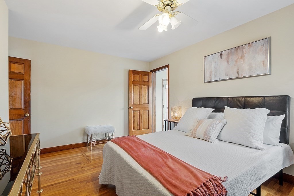 2 Bond Place Saugus, MA 01906 - Photo 27 of 42 a bedroom with a bed and a chandelier