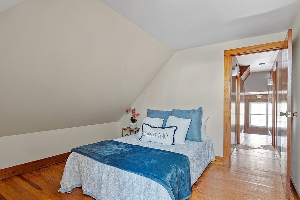 2 Bond Place Saugus, MA 01906 - Photo 31 of 42 a bedroom with a bed and wooden floor