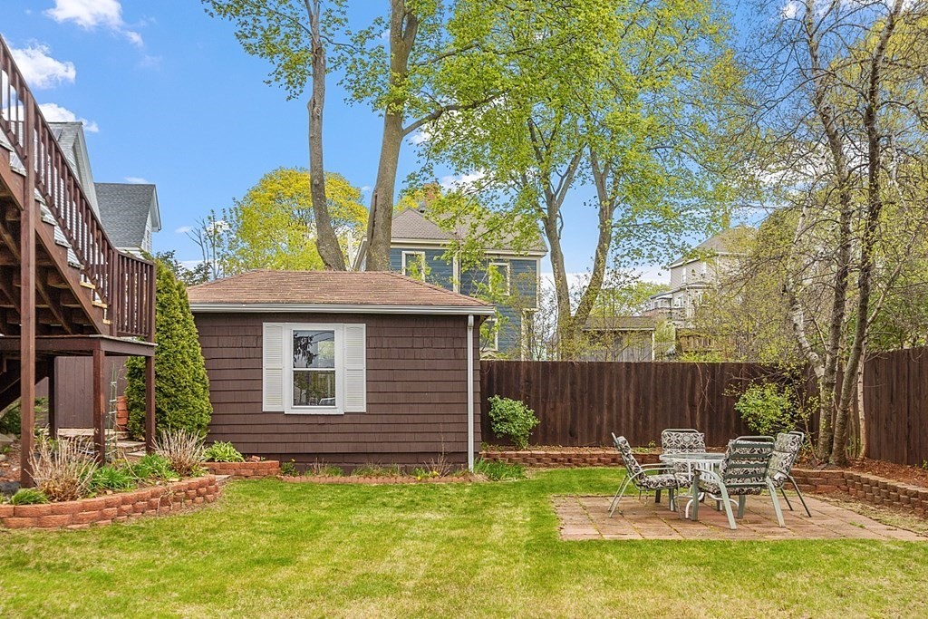 2 Bond Place Saugus, MA 01906 - Photo 6 of 42 a view of a chairs and table in backyard of the house