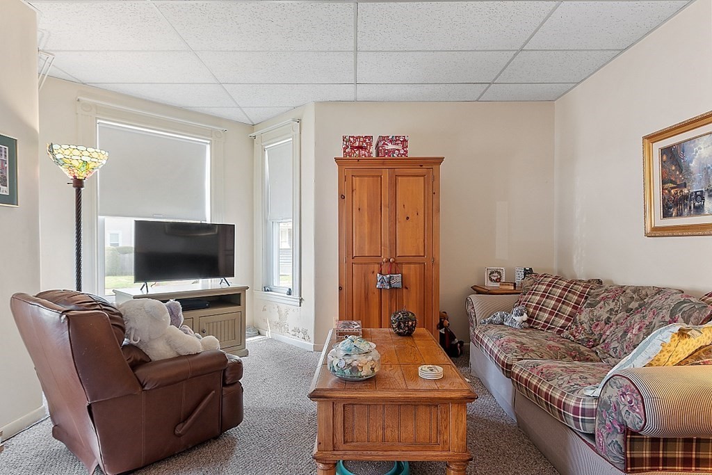 2 Bond Place Saugus, MA 01906 - Photo 10 of 42 a living room with furniture and a flat screen tv