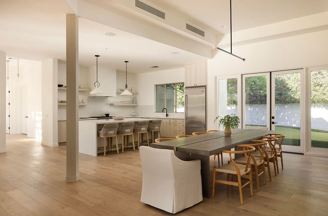a kitchen with a sink a stove and a refrigerator