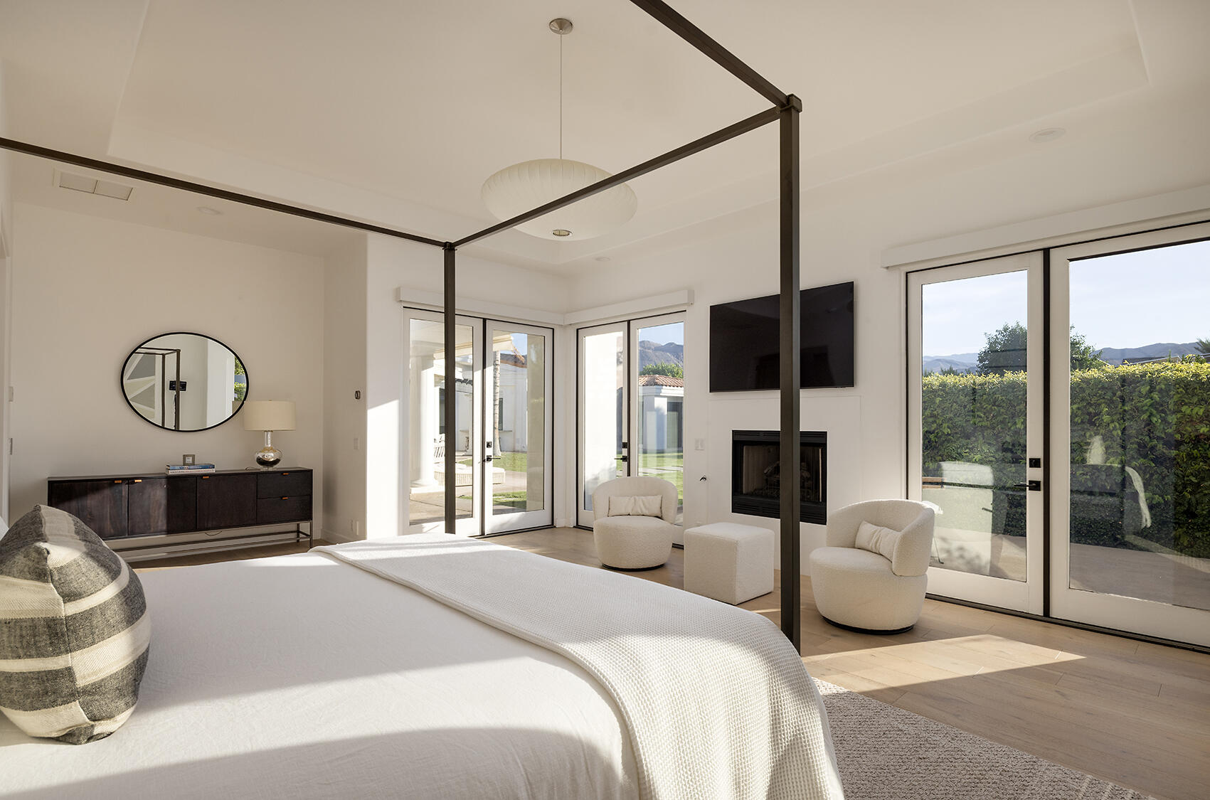 72355 Morningstar Road Rancho Mirage, CA 92270 - Photo 21 of 50 a bedroom with a balcony a bed and a television