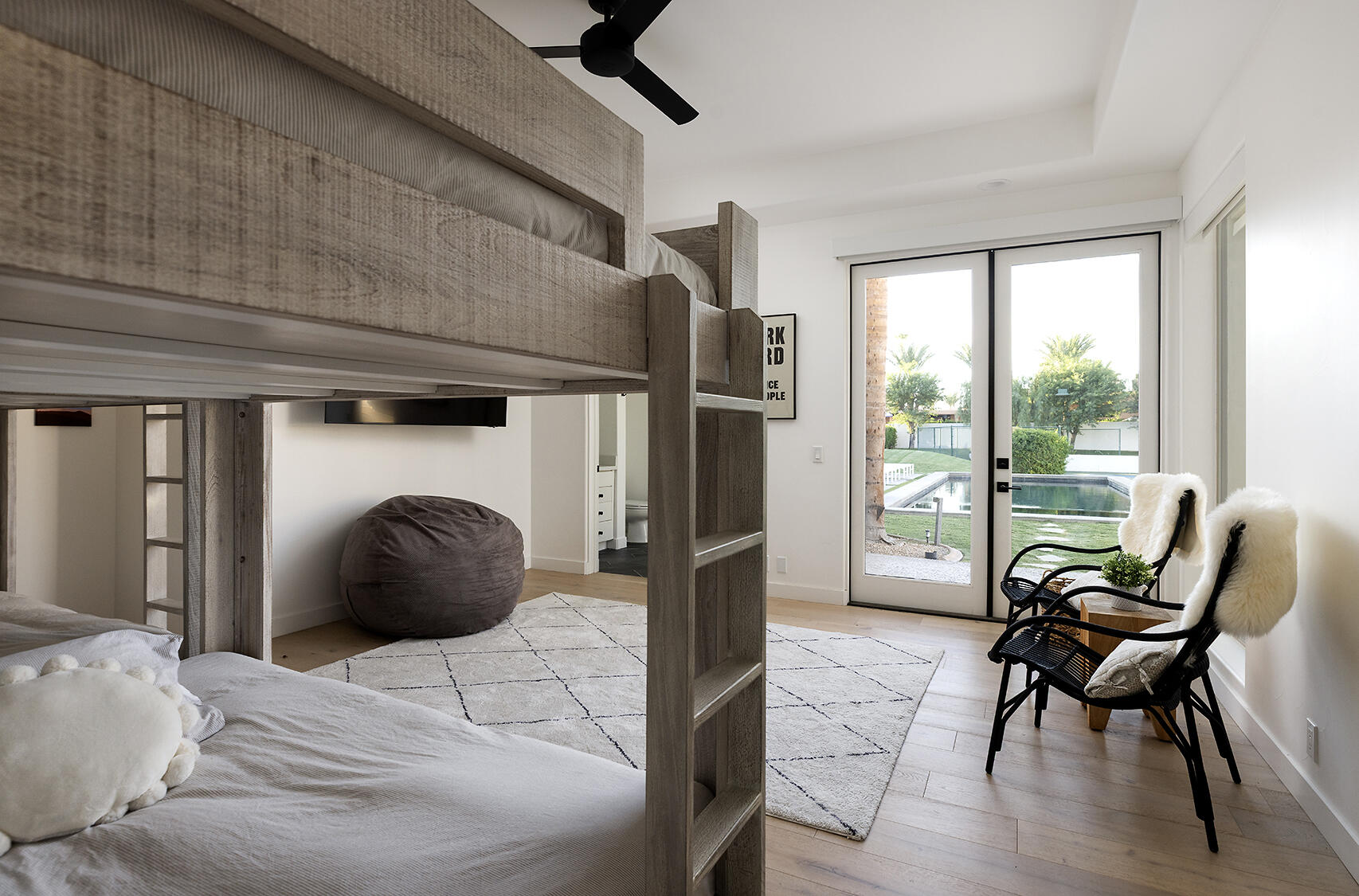 72355 Morningstar Road Rancho Mirage, CA 92270 - Photo 28 of 50 a bedroom with a bed and a large window