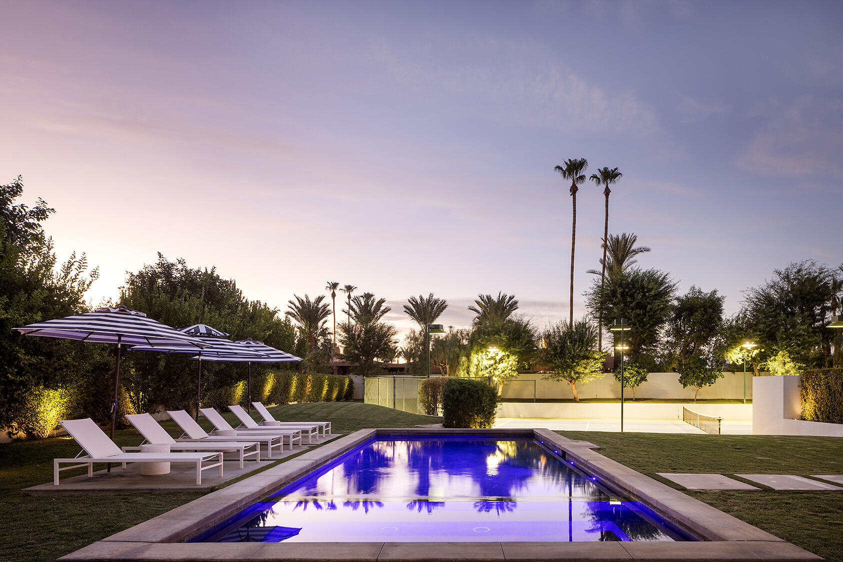 72355 Morningstar Road Rancho Mirage, CA 92270 - Photo 3 of 50 a view of a swimming pool with a patio and a yard