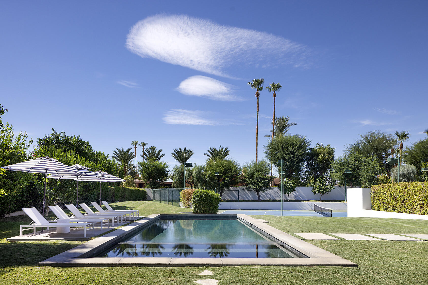 72355 Morningstar Road Rancho Mirage, CA 92270 - Photo 32 of 50 a view of a swimming pool with a patio