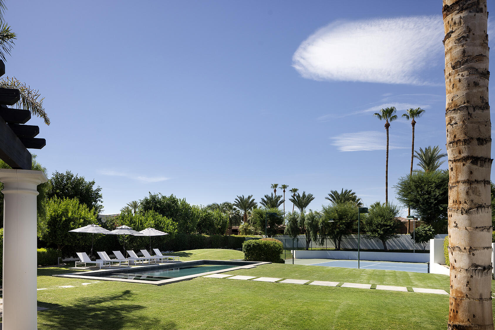 72355 Morningstar Road Rancho Mirage, CA 92270 - Photo 33 of 50 a swimming pool with an outdoor seating and yard
