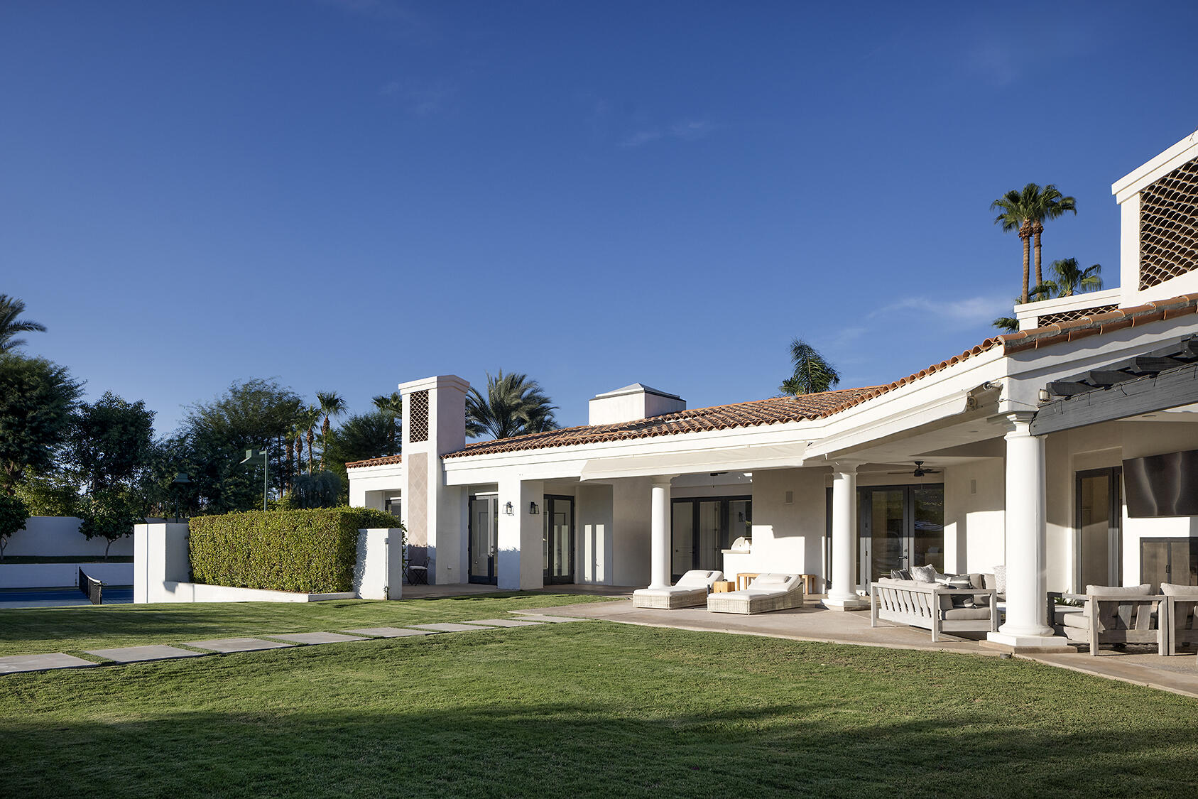 72355 Morningstar Road Rancho Mirage, CA 92270 - Photo 35 of 50 a front view of a house with a garden and porch