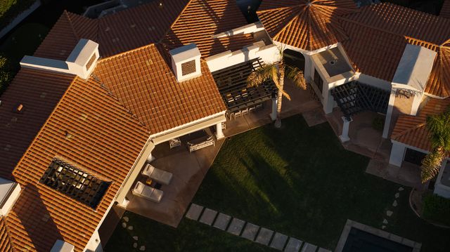 an aerial view of a house with a garden