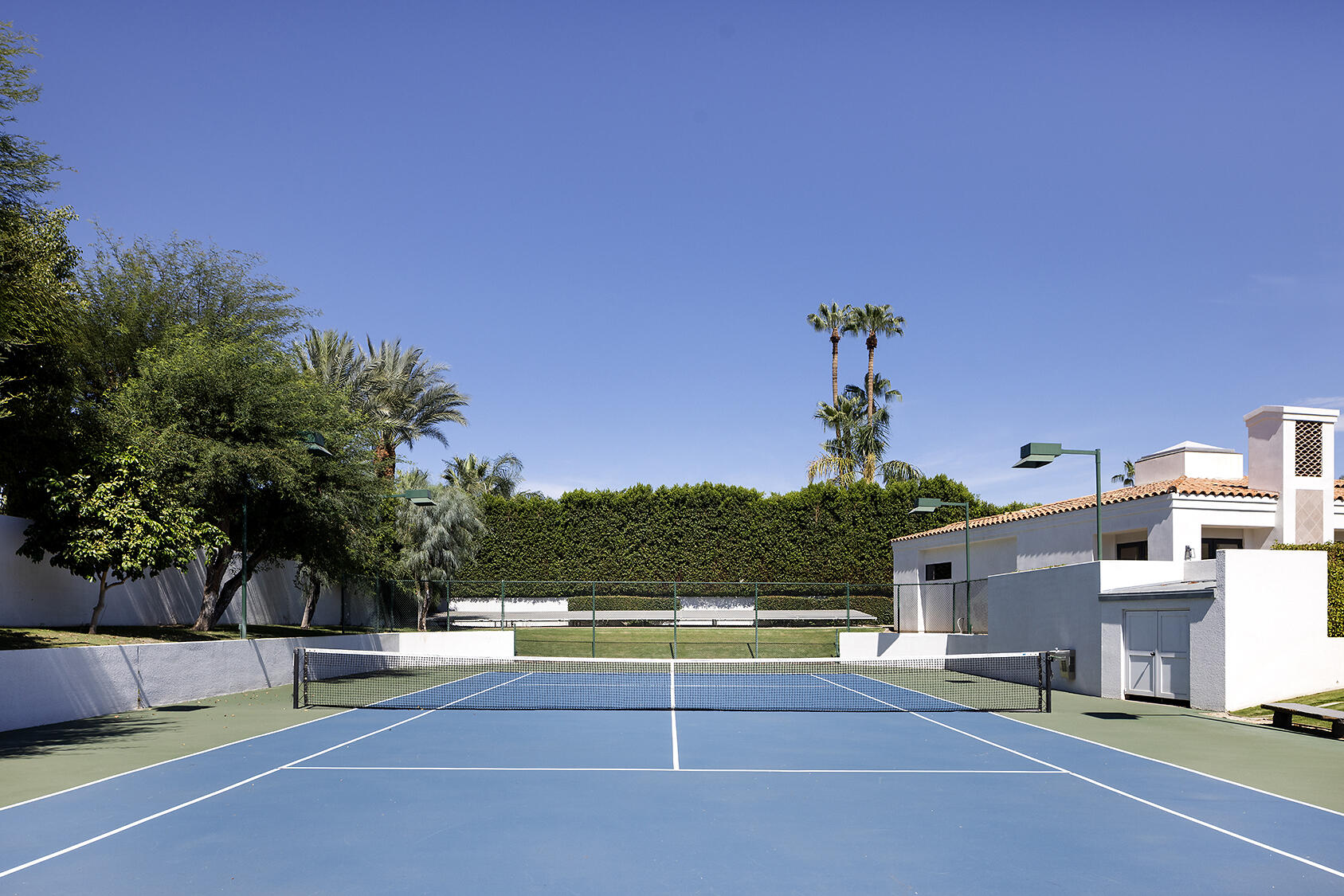 72355 Morningstar Road Rancho Mirage, CA 92270 - Photo 8 of 50 a view of a swimming pool with an outdoor seating and a palm tree