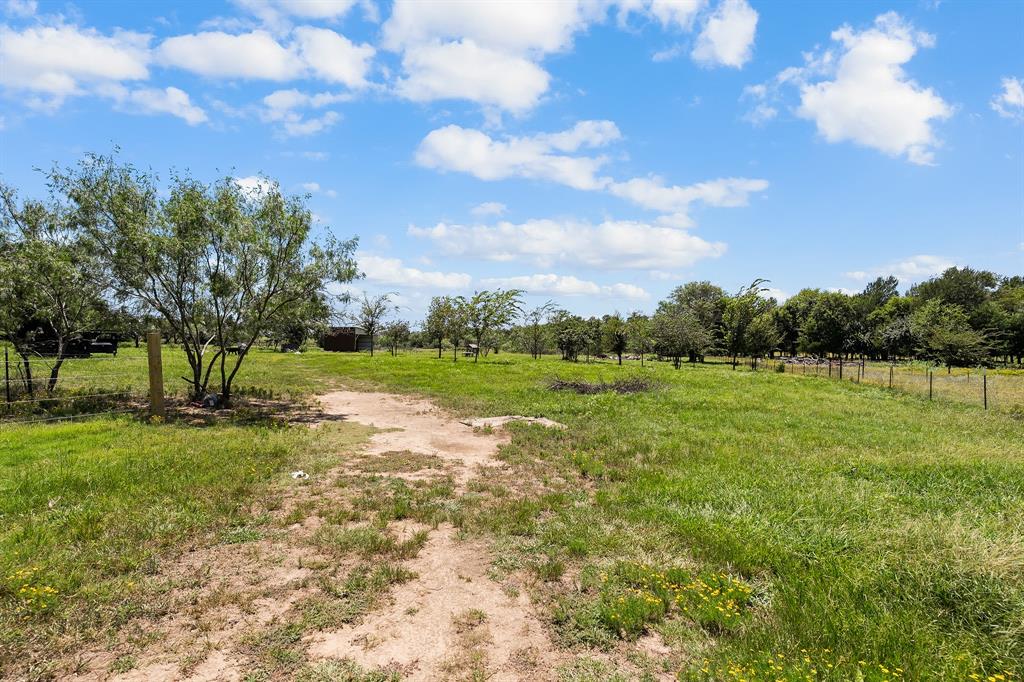 2797 County Road 3417 Wills Point, TX 75169 - Photo 11 of 22 a view of a garden with a fountain