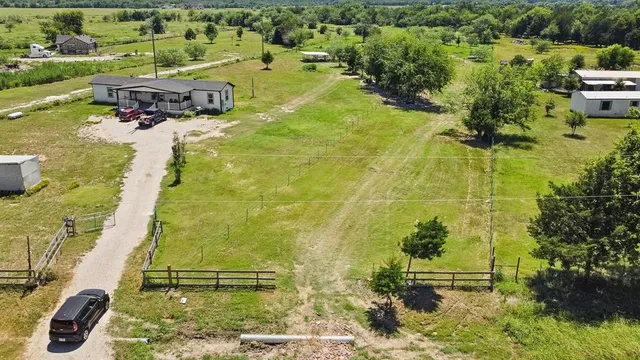 a aerial view of a house with a yard