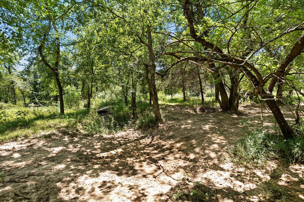 2797 County Road 3417 Wills Point, TX 75169 - Photo 4 of 22 a view of outdoor space with deck and yard