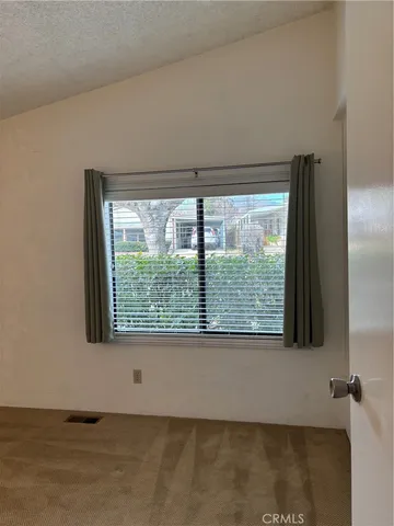 a view of a room that has a large window
