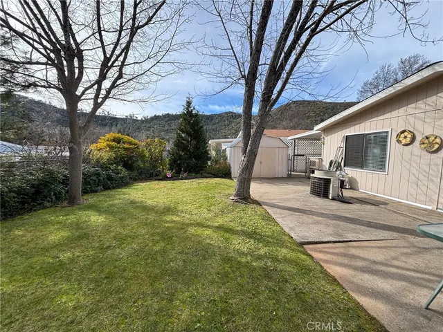 a view of a patio with a yard