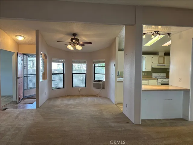 a view of an empty room and window