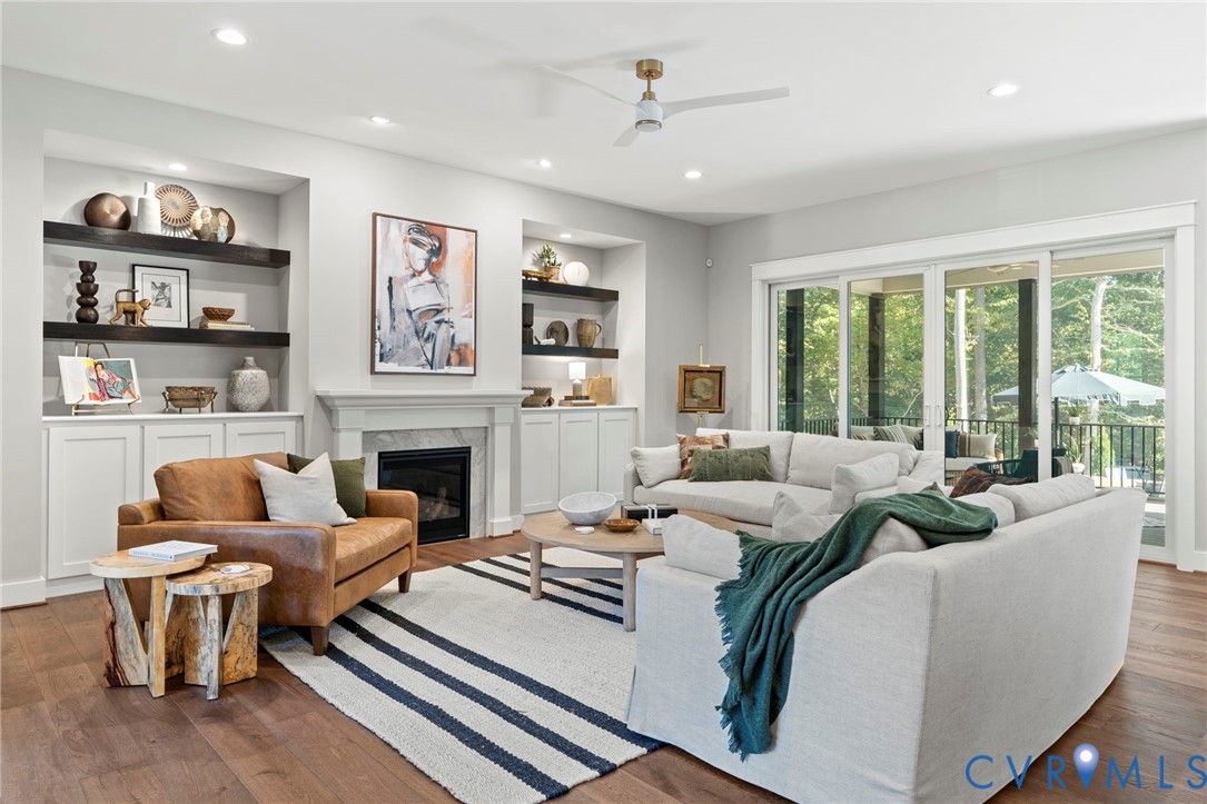 4764 Gooden Trail Quinton, VA 23141 - Photo 17 of 50 Living room with wood finished floors, built in sh