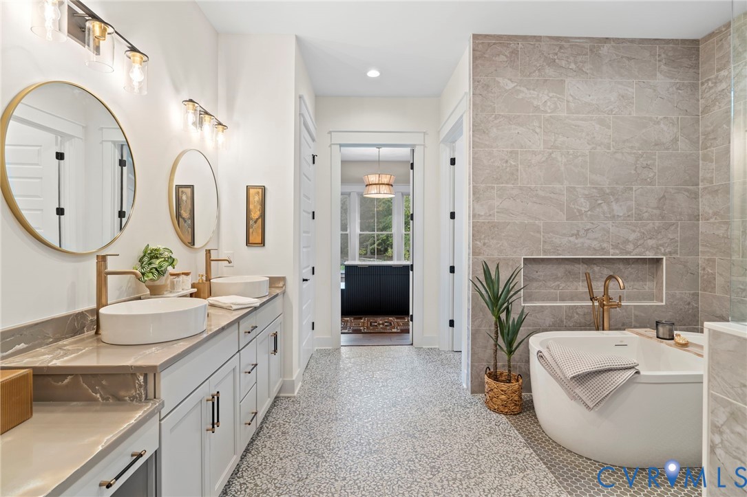 4764 Gooden Trail Quinton, VA 23141 - Photo 31 of 50 Full bath with tile walls, double vanity, a soakin