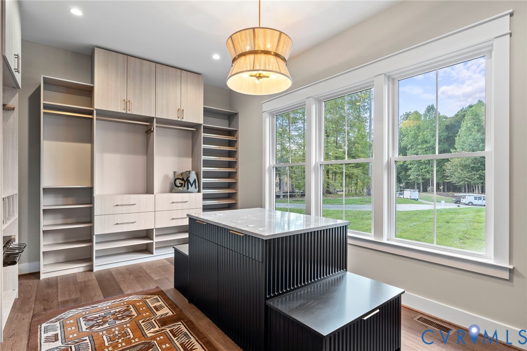 4764 Gooden Trail Quinton, VA 23141 - Photo 34 of 50 Walk in closet with light wood finished floors
